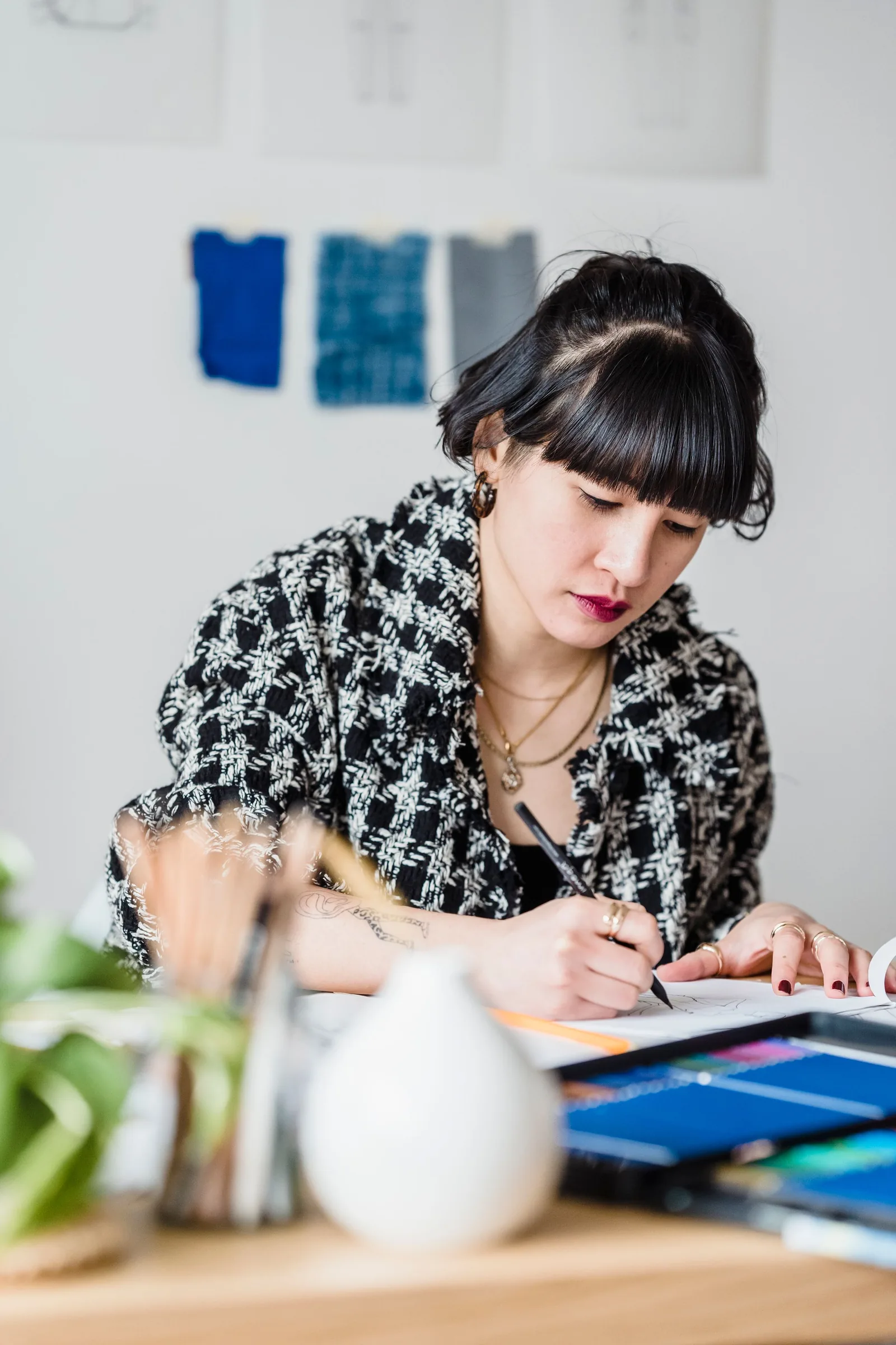 Designer sketching brand ideas at a desk