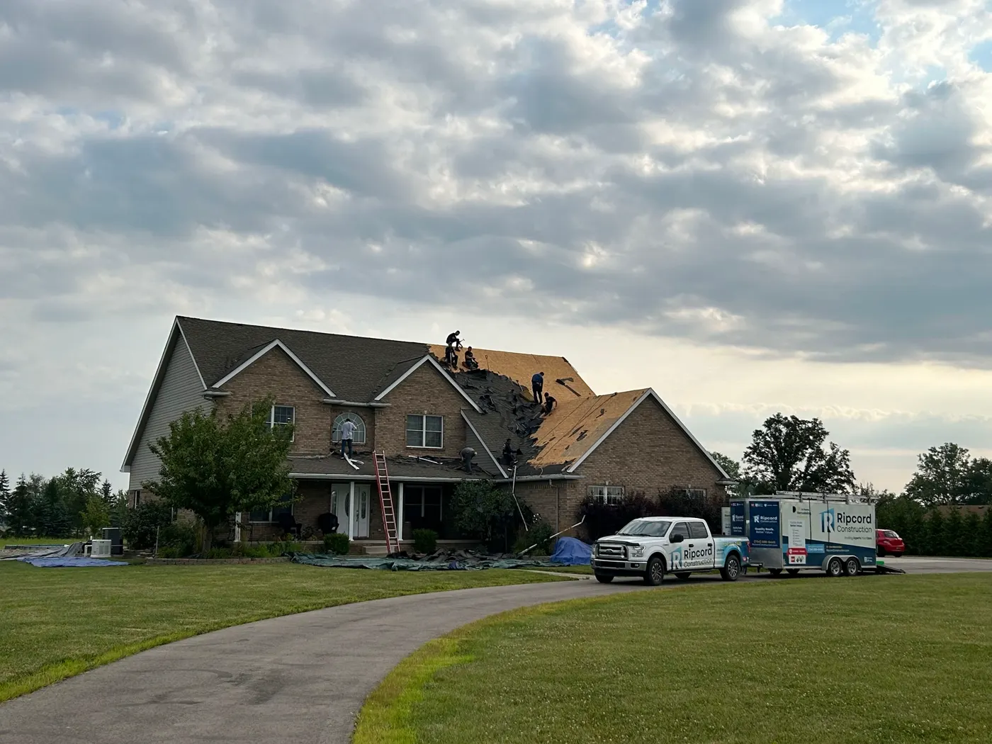 Michigan roofing crew working on a residential roof