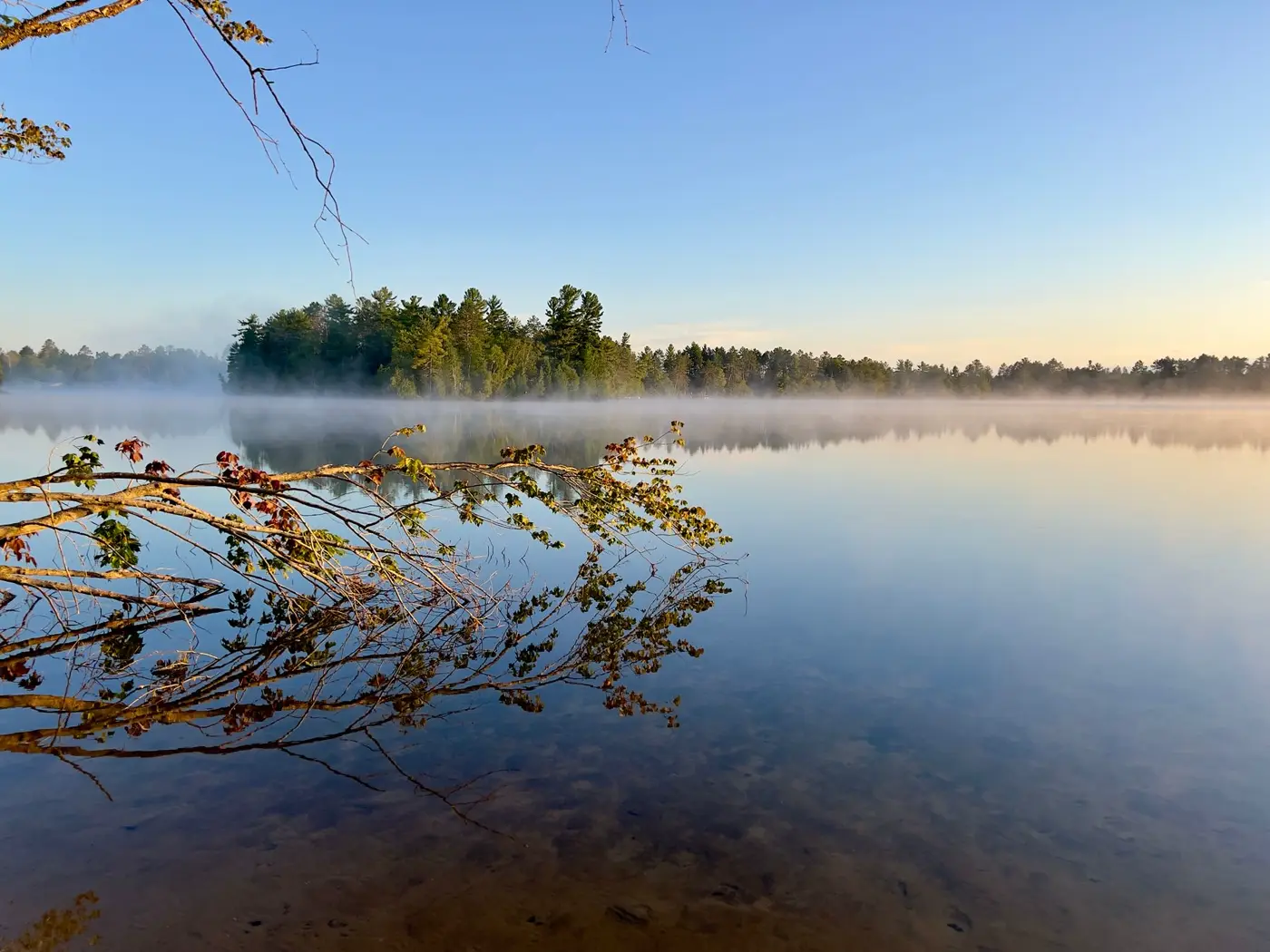 Misty Michigan lake at sunrise
